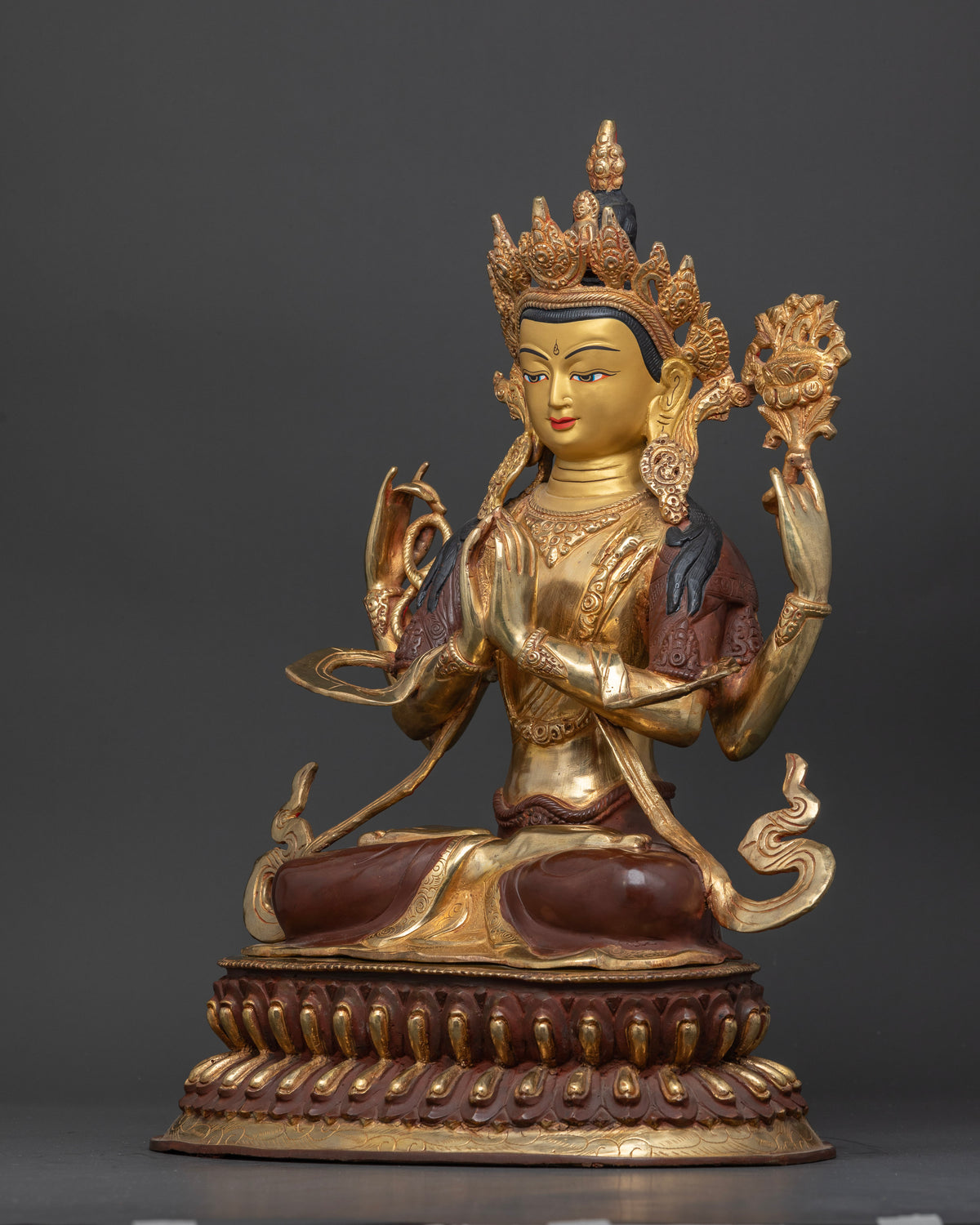 Compassionate Chenrezig buddhist statue with crystal rosary blooming white lotus and sacred jewel.