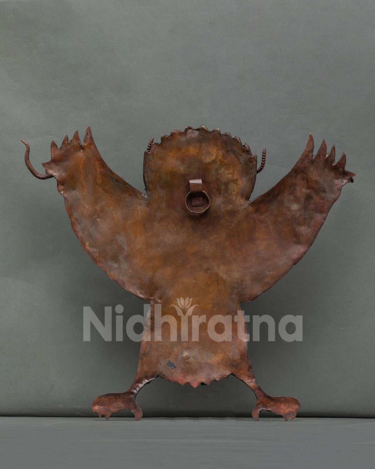 Copper Garuda wall hanging showing strength courage and protection in Nepalese art