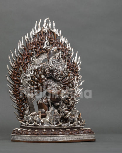 Copper Yamantaka Buddhist statue with oxidized and silver-plated details on a lotus seat