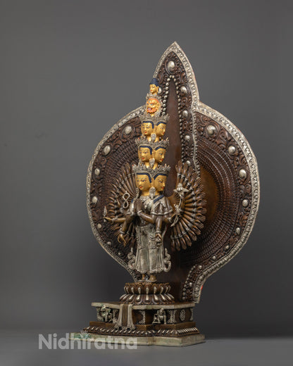 craftsmanship of lost wax method on copper body of 1000 Armed Chenrezig statue with sacred Buddhist symbolism