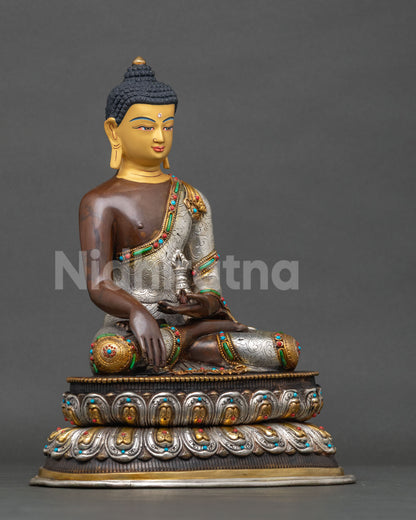 Crown Mitrugpa Buddha earth touching mudra dorje lotus pedestal.