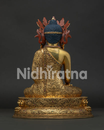 crowned shakyamuni buddha statue back view showcasing intricate repoussé and hand carved details