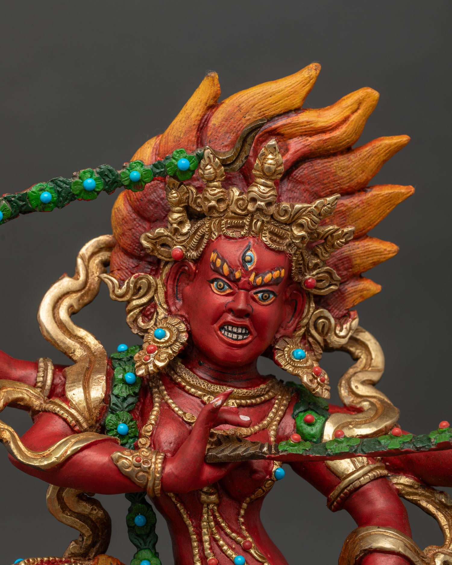 Dancing Kurukulla copper statue with gold gilding and acrylic details close up