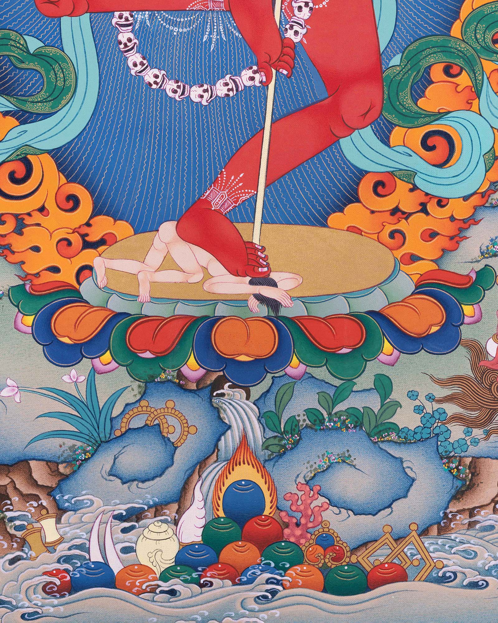 Detail of Dorje Phagmo's feet on lotus pedestal above skull garland and ritual offerings