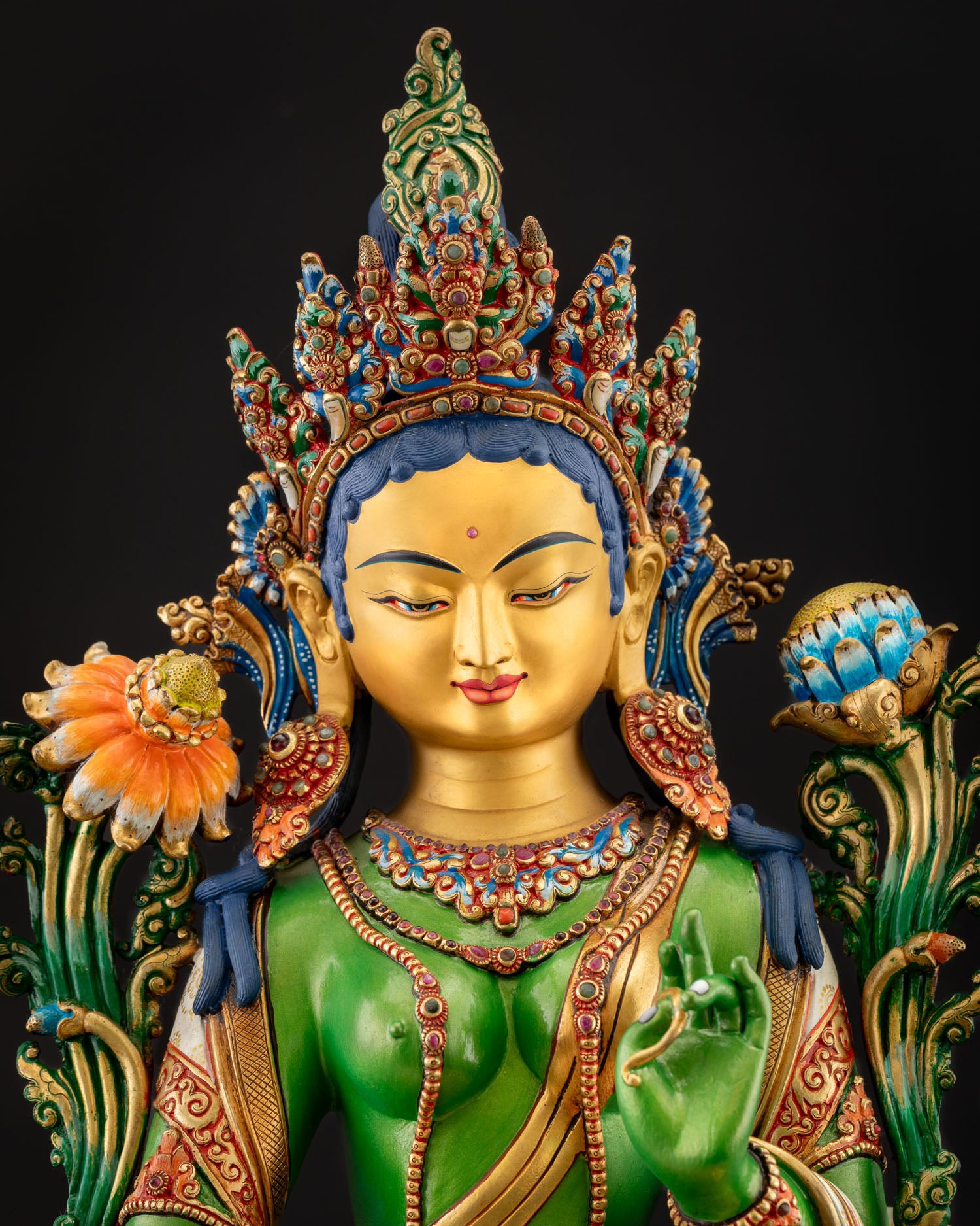Detail of five‑jeweled crown and gemstone‑embellished earrings on Green Tara Statue