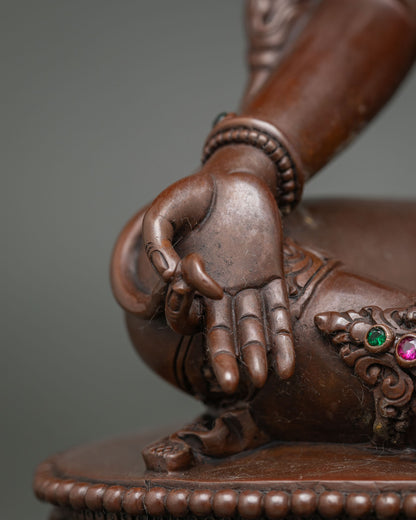 Detail of Green Tara hand showing Varada Mudra posture of generosity