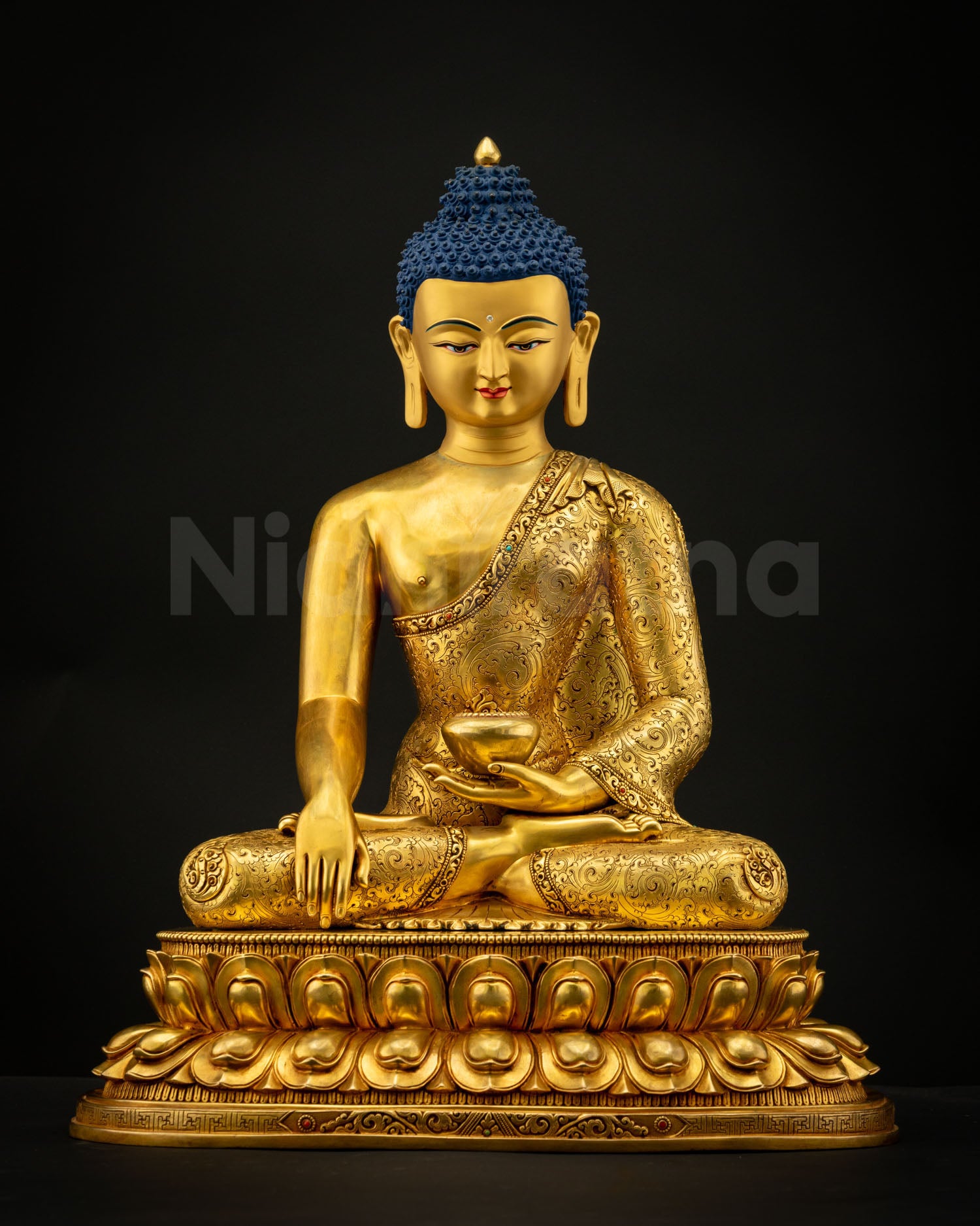 Detail view of Shakyamuni Buddha Statue showing left hand holding begging bowl symbolizing renunciation and monastic discipline.
