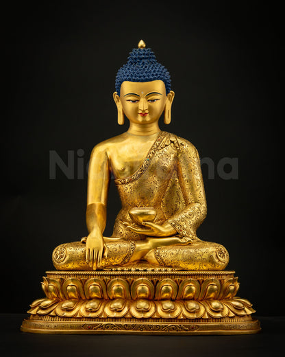 Detail view of Shakyamuni Buddha Statue showing left hand holding begging bowl symbolizing renunciation and monastic discipline.