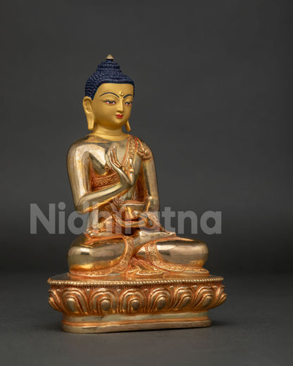 Detailed Amoghasiddhi Buddha face with traditional Nepalese gold gilded craftsmanship
