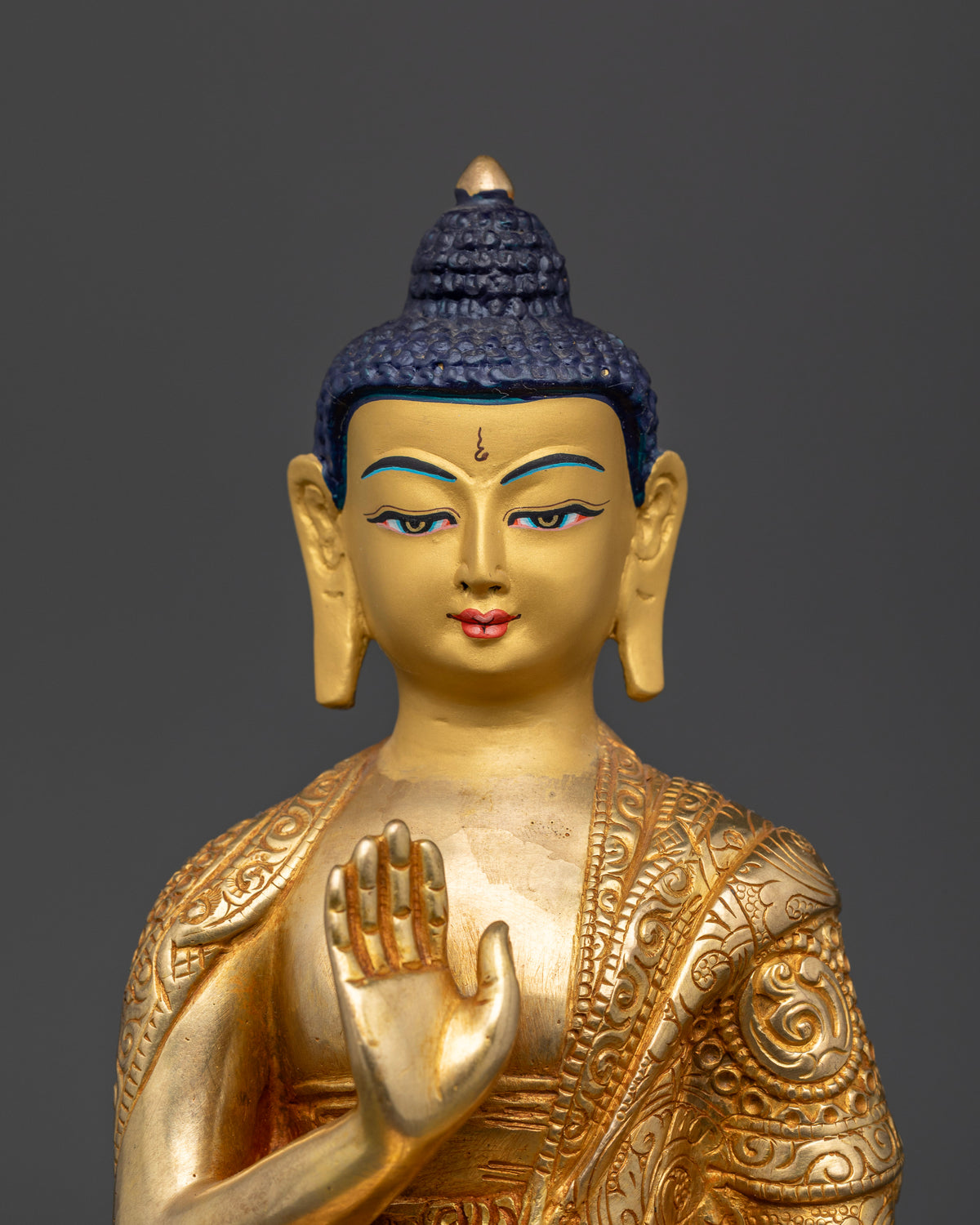 Detailed Amoghasiddhi Buddha Statue with 24K gold painted calm expression.