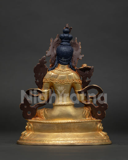 Detailed back view of Green Tara statue showcasing hand carved lotus pedestal and vajra symbol.