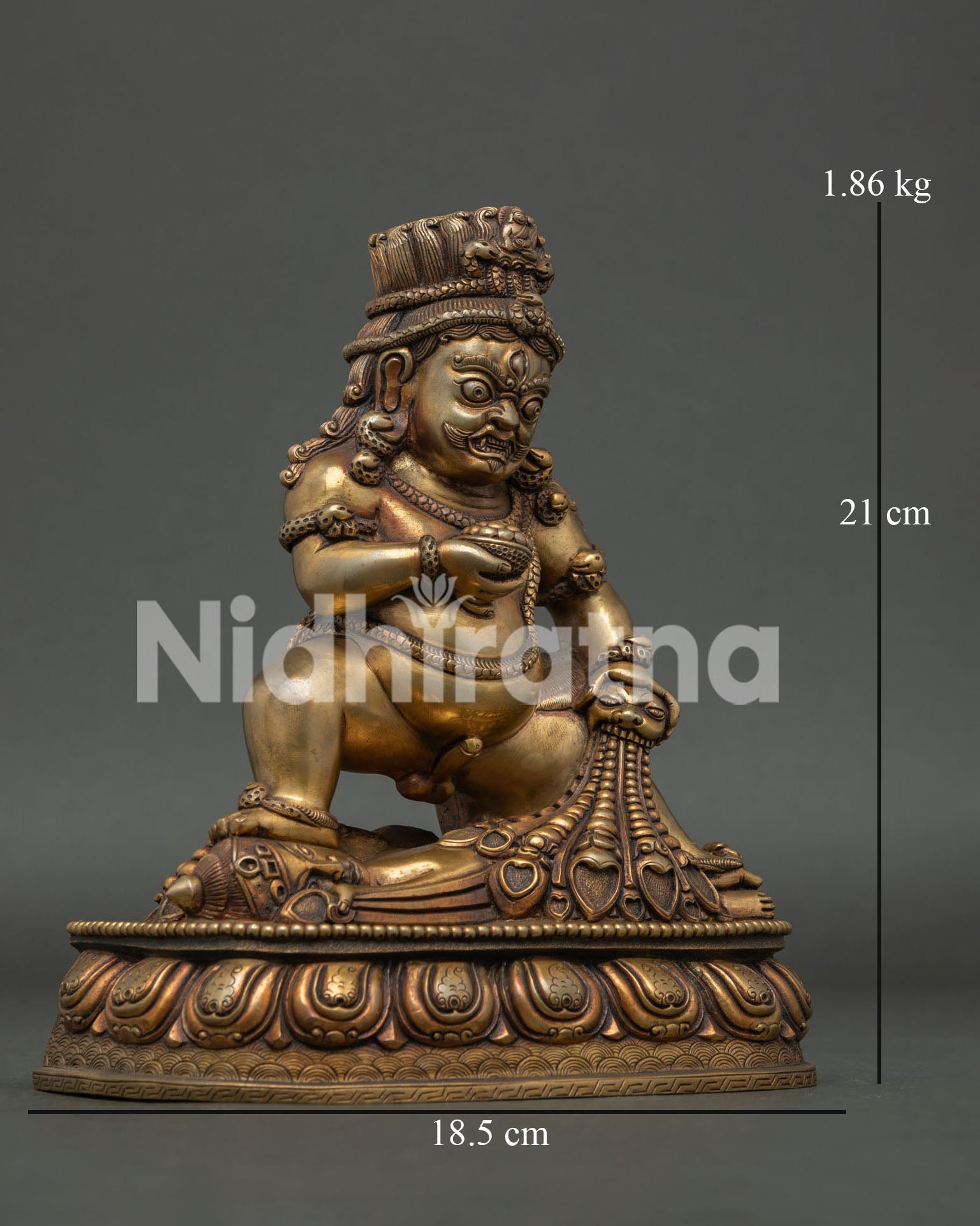 Detailed Black Dzambhala with wrathful expression and antique copper finish.