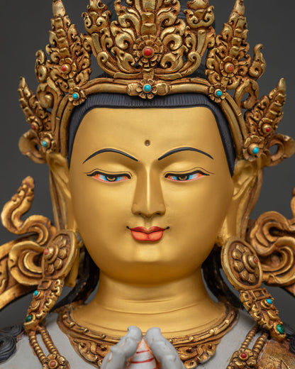 Detailed Chenrezig Avalokiteshvara statue face with 24K gold-painted features