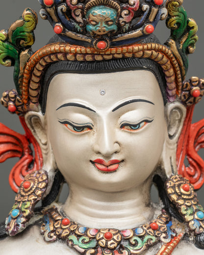 detailed close up face of chenrezig statue gold gilded features and serene expression