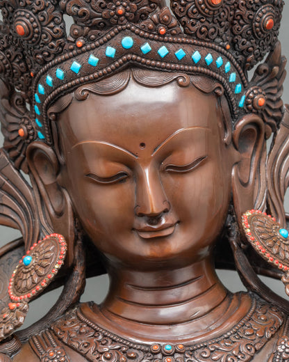 Detailed close-up of Green Tara statue highlighting intricate copper jewelry and crown