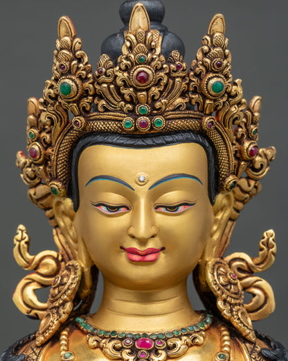 Detailed close up of Amitayus Buddha statue face, hand-painted serene expression and five-jeweled crown