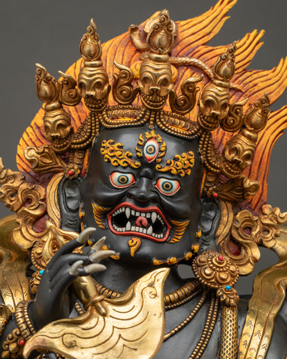 Detailed close up of Black Mahakala face with third eye and five-skull crown, handcrafted copper