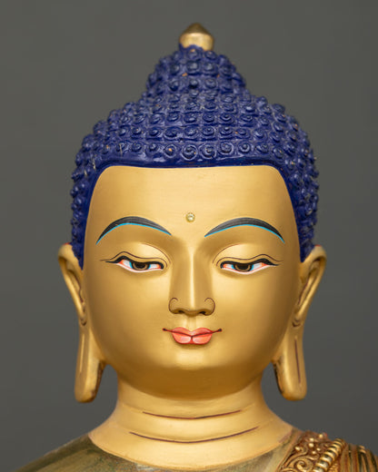Detailed close-up of Buddha Shakyamuni statue, highlighting gold gilded finish, and authentic Nepalese artisan work.