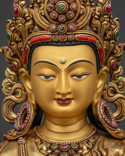 detailed close up of chenrezig statue gold painted face and jeweled crown detailing