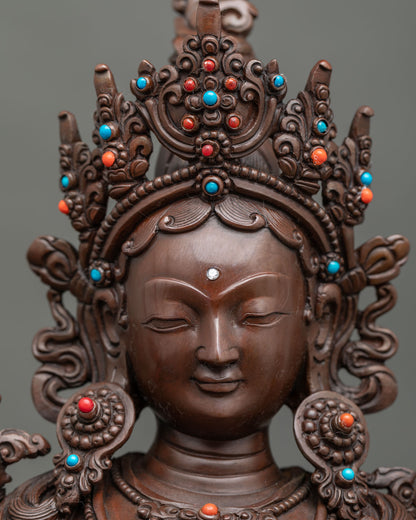 Detailed close-up of Green Tara statue featuring a five-jewel crown and traditional Newari craftsmanship.