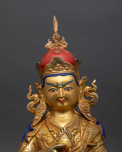 detailed close-up of guru norlha statue face with serene expression and gold accents