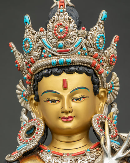 Detailed close-up of Lokeshvara statue's serene gold-gilded face and jeweled crown