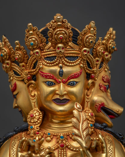 Detailed close-up of Marichi's wrathful face, skull crown, gold fire-gilded copper statue