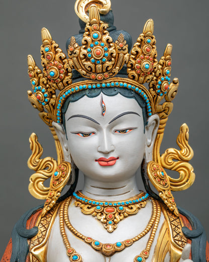 Detailed close-up of Sitatapatra statue face with third eye and jeweled crown, Nepali Dukkar copper art