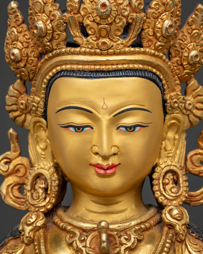 Detailed close up of Vajrasattva face with serene expression and Five-Jeweled Crown, gold gilded copper