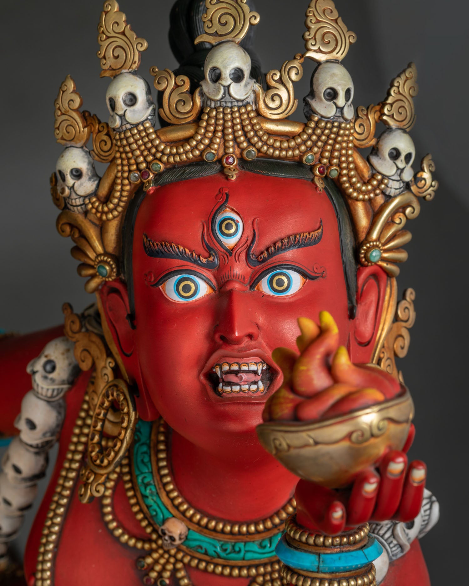 Detailed close-up of Vajrayogini's hand-painted face and third eye
