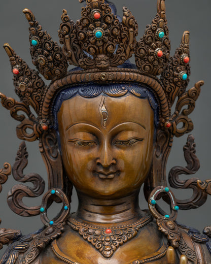 Detailed close-up of White Tara statue's serene face showing forehead and eye detail