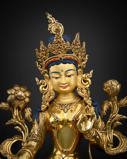 Detailed close-up view of Green Tara Buddhist statue showing serene face and crown details