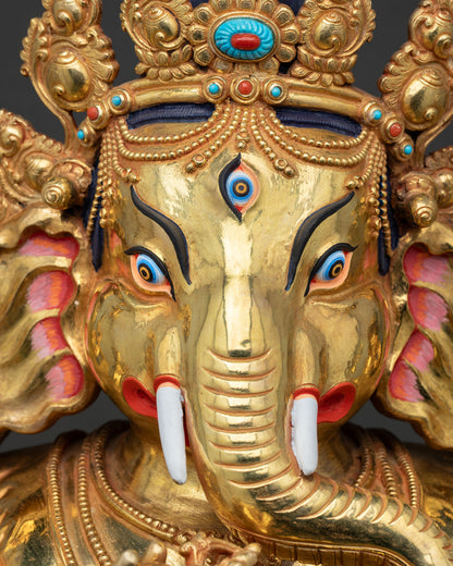 Detailed crown of Ganesh statue with turquoise coral gemstone inlay work