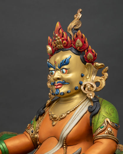 Detailed Dzambhala statue face showing serene expression ornate crownd
