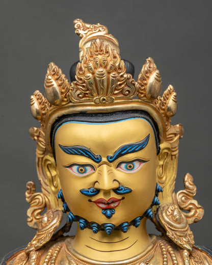 Detailed face close-up of Dzambhala Statue, gold and blue features, fierce yet compassionate