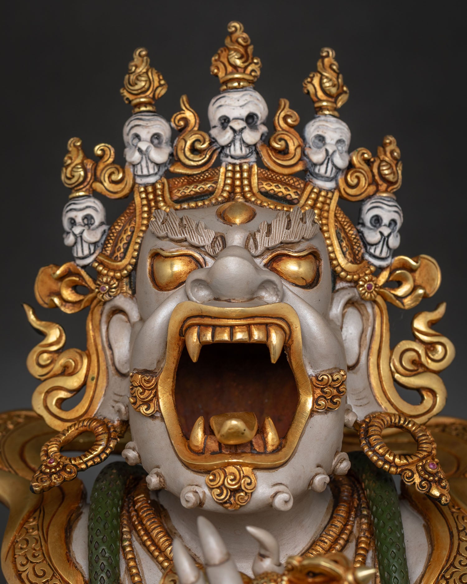 Detailed face close-up of Dorje Khadro statue, wrathful Buddhist deity carving