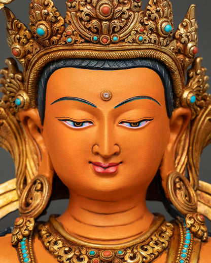Detailed face close-up of Manjushri Statue showing repoussé work and symbolic orange acrylics