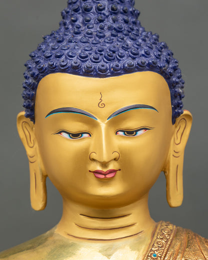 Detailed face close-up of Shakyamuni Buddha, gold fire-gilded with serene expression