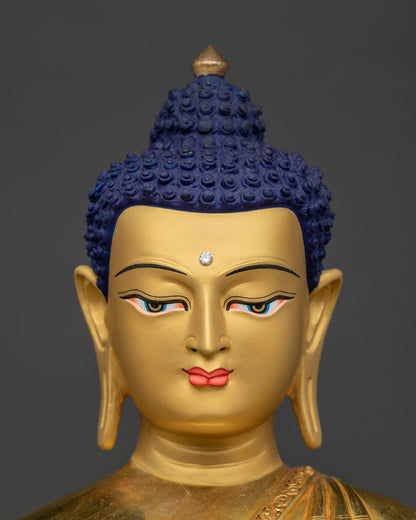 Detailed face of Shakyamuni Buddha statue, serene gold expression, blue ushnisha, third eye, Nepal crafted