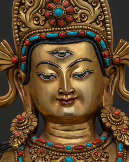 Detailed face view of Sakra Indra statue highlighting the third eye and gold craftsmanship
