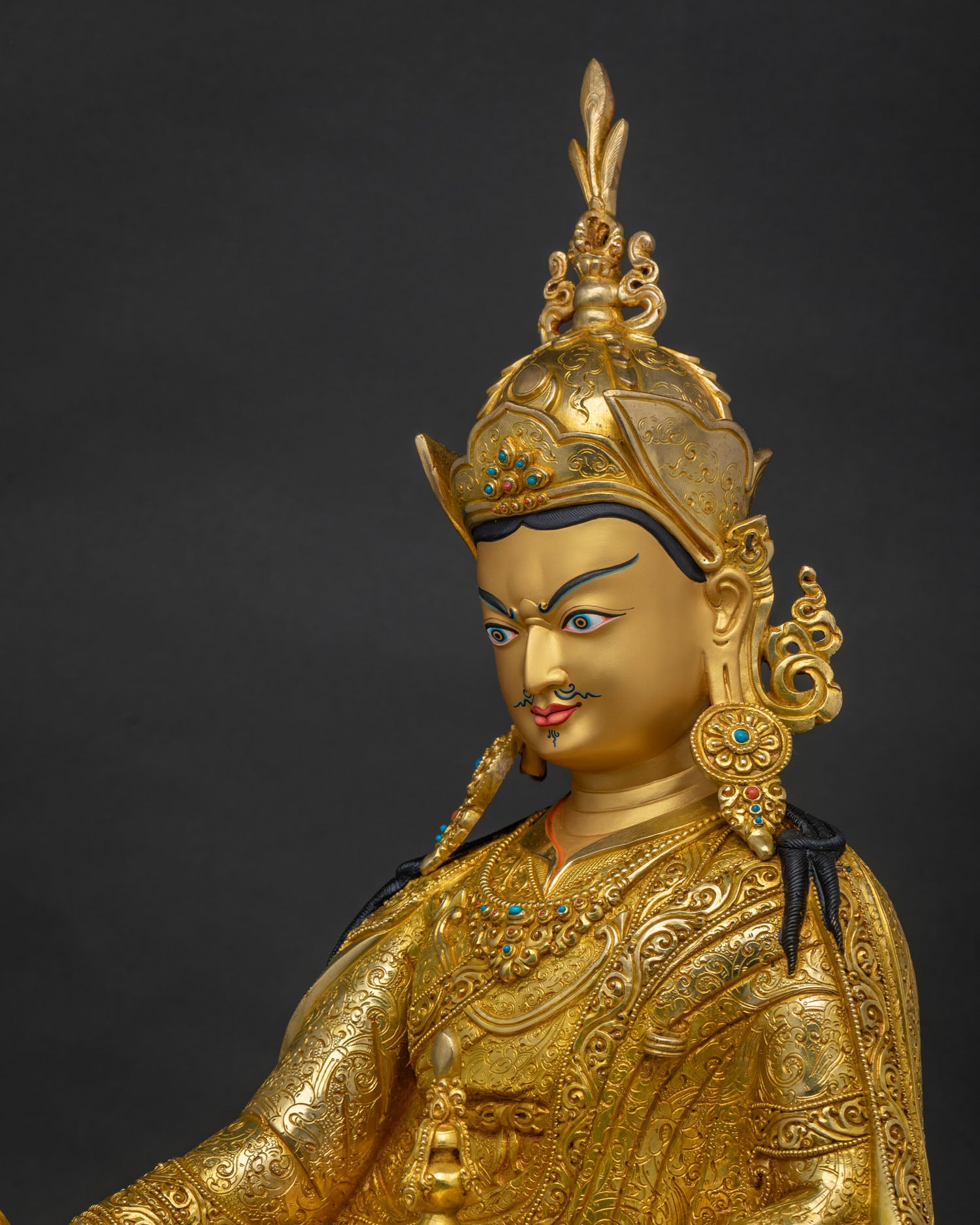 Detailed Gold Painted Face of Guru Rinpoche Statue with Compassionate Himalayan Artistry