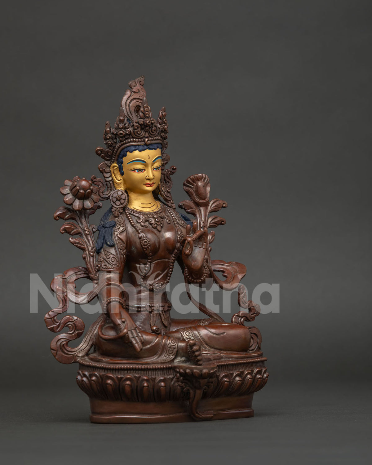 Detailed Green Tara buddhist statue showing varada and abhaya mudras.
