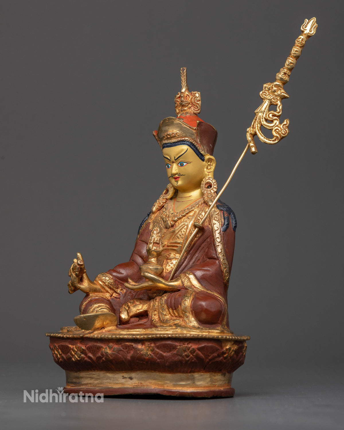 Detailed Guru Rinpoche Statue with khatvanga staff and handcarved royal garment.