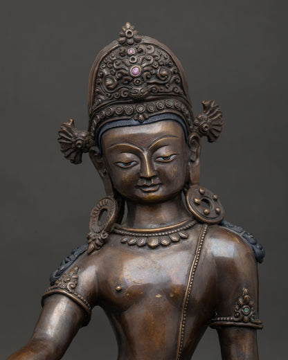 Detailed Indra statue featuring carved crown and lotus base.