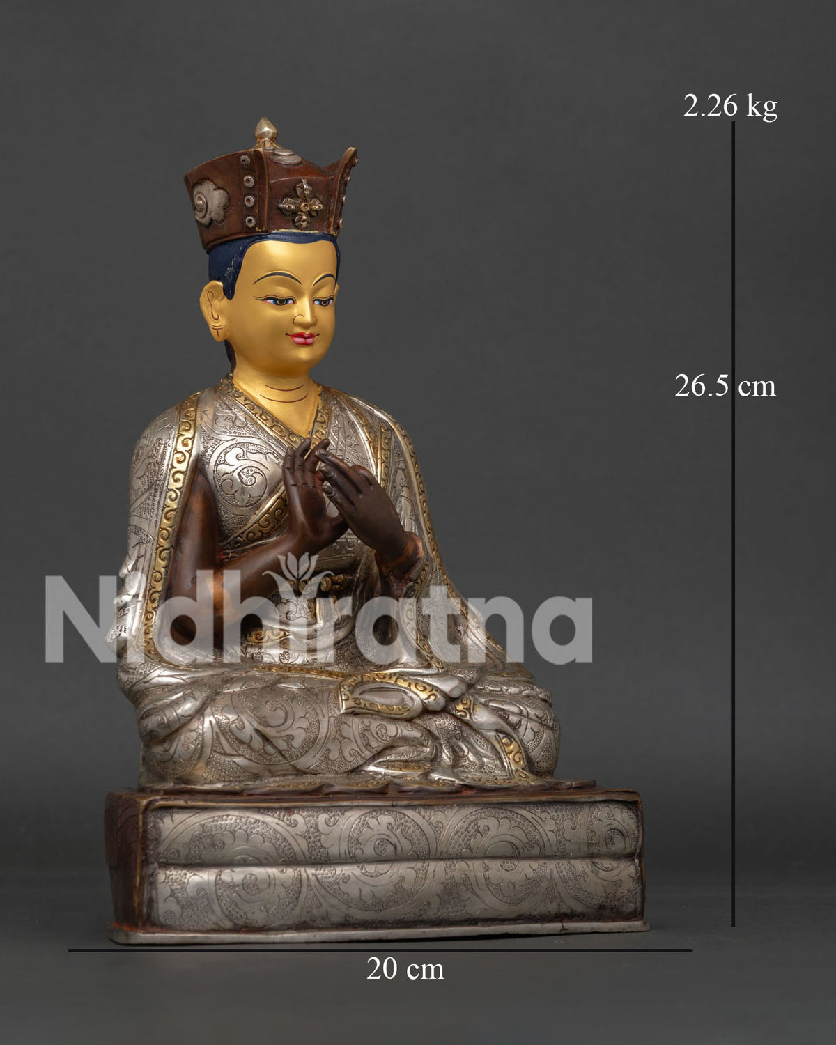 Detailed Karmapa statue showing black ritual crown gold painted face and carved robes.