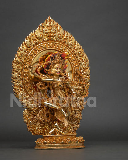 Detailed kurukulla statue standing on lotus seat subduing human figure with skull garland.