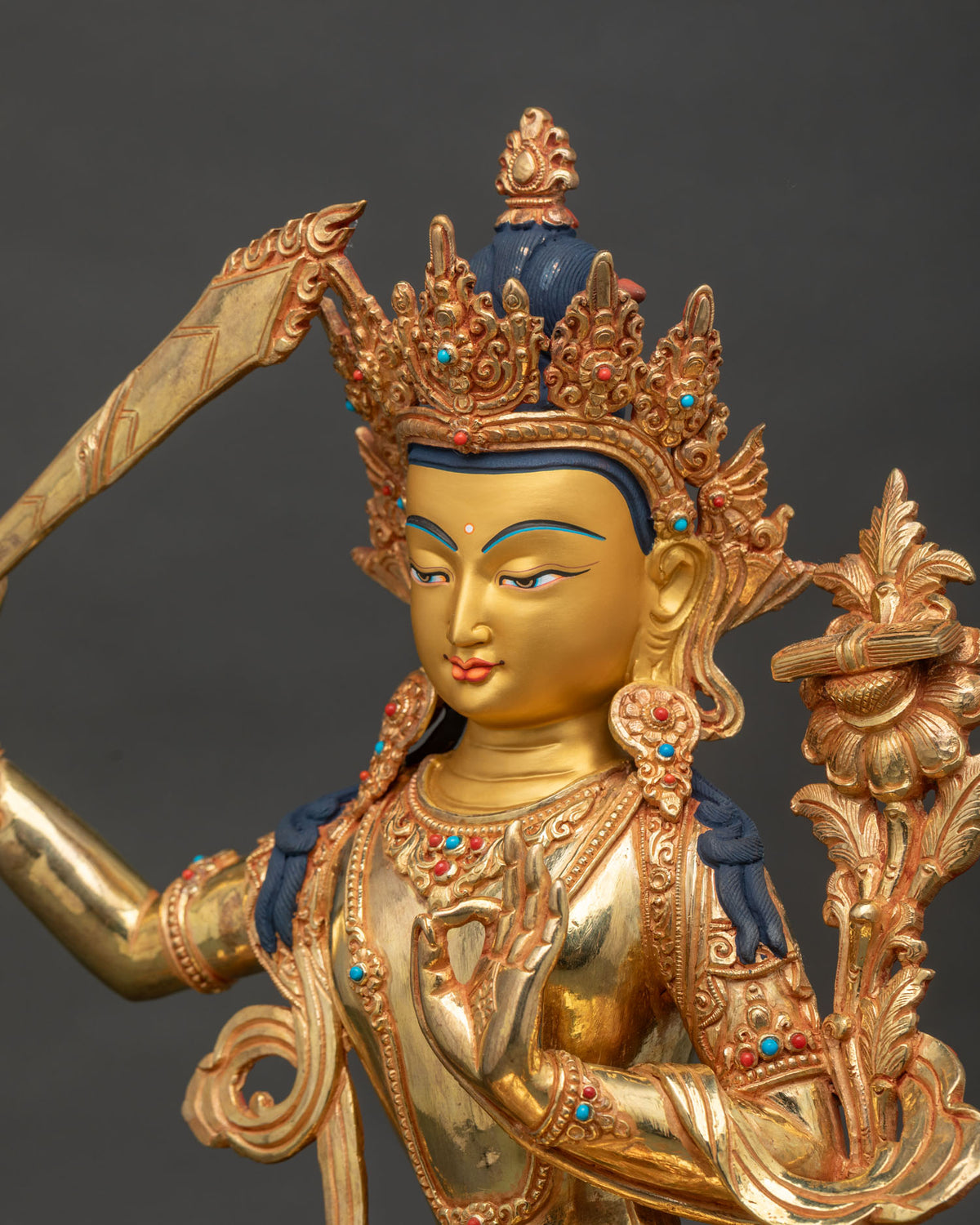 Detailed manjushri statue symbolizing wisdom insight clarity and transcendent wisdom.