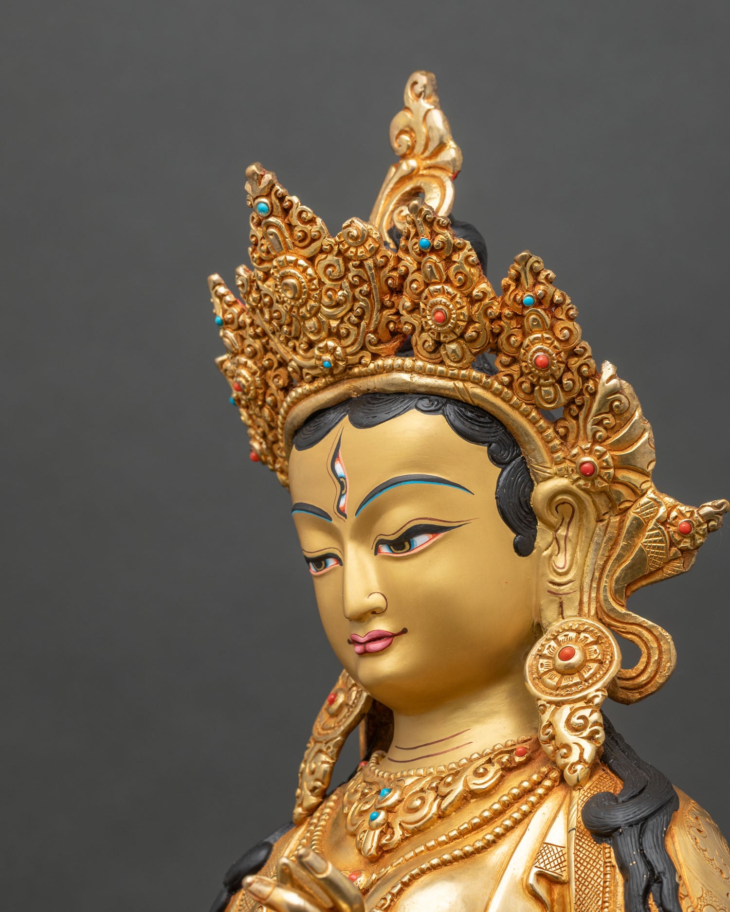 Detailed side close-up of Dukar statue, showing parasol, mirror, and fine Newari craftsmanship