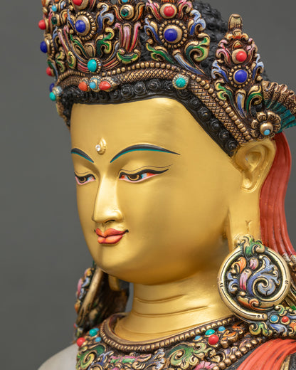 detailed side close up face of crown shakyamuni buddha statue with gentle smile and semi-precious stones