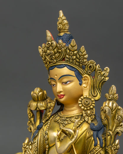 green tara statue side view highlighting intricate copper and gold work